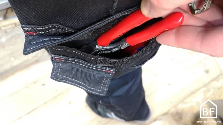 poche avec rabat contenant des outils
